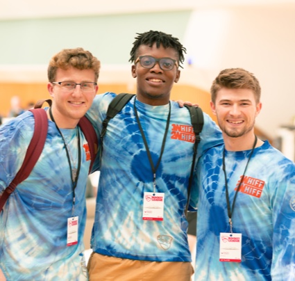 Group of three male students wearing blue type-dye