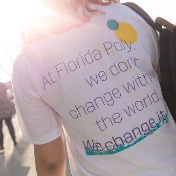 T-shirt that reads 'At Flordia Poly, we don't change with the world. We change it.